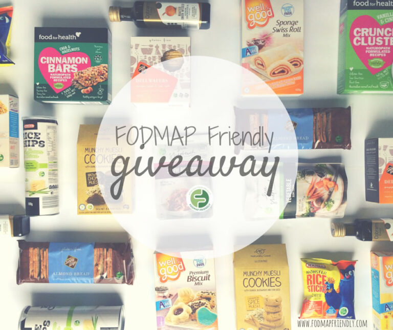 A flat lay of various FODMAP-friendly food products, such as bars, biscuits, rice crisps, and sauces, arranged around a circle with text that says FODMAP Friendly giveaway.