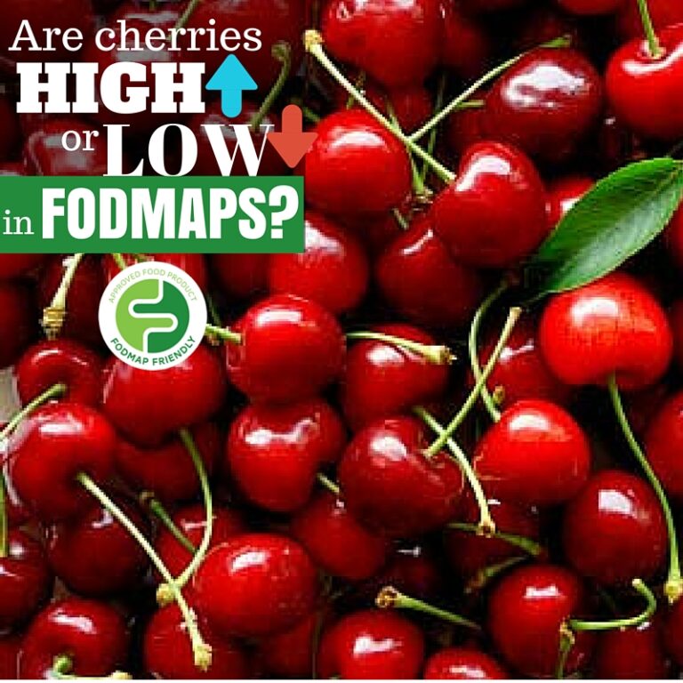 A pile of fresh red cherries fills the image. Text over the cherries asks, Are cherries high or low in FODMAPs? with a FODMAP Friendly certification logo shown.