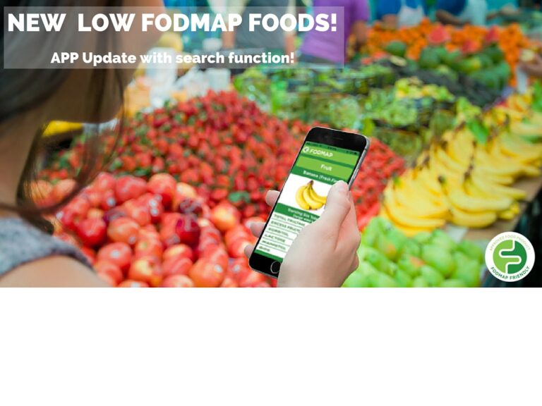 A person holds a smartphone displaying a FODMAP food app whilst shopping for fresh fruit and vegetables at a market. Text overlay reads: NEW LOW FODMAP FOODS! APP Update with search function!.