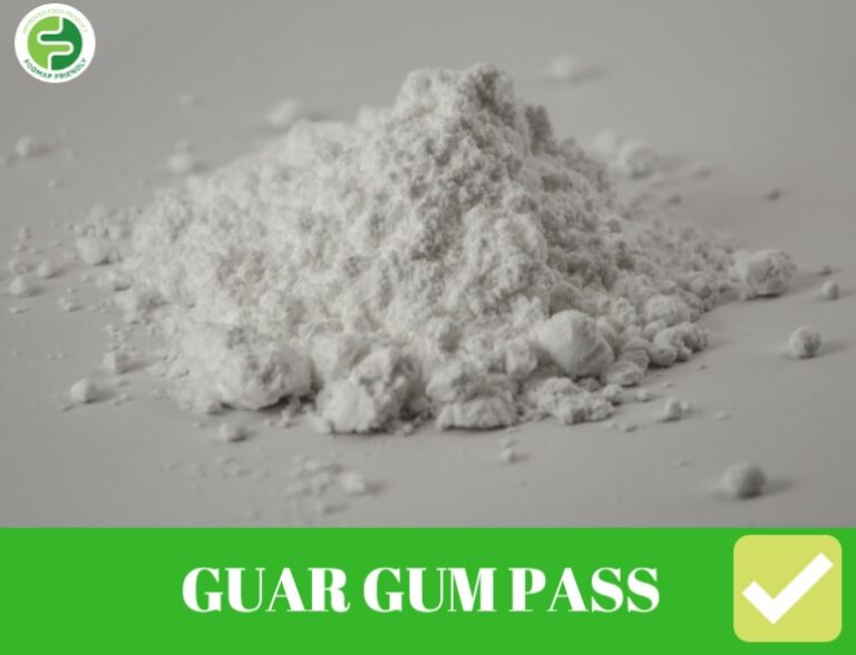 A mound of white powder on a light surface, labelled GUAR GUM PASS in bold white letters on a green banner with a white tick in the bottom right corner.