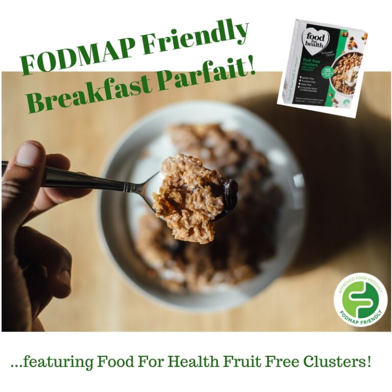 A hand holds a spoonful of cereal above a bowl on a wooden table. Green text reads FODMAP Friendly Breakfast Parfait! and a cereal box is shown in the upper right corner. A FODMAP Friendly logo is at the bottom.