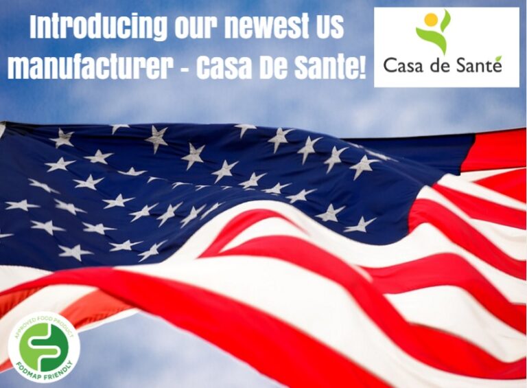 An American flag waves in the foreground. Text reads, Introducing our newest US manufacturer - Casa De Sante! Casa De Sante and FODMAP Friendly logos appear at the top right and bottom left corners, respectively.