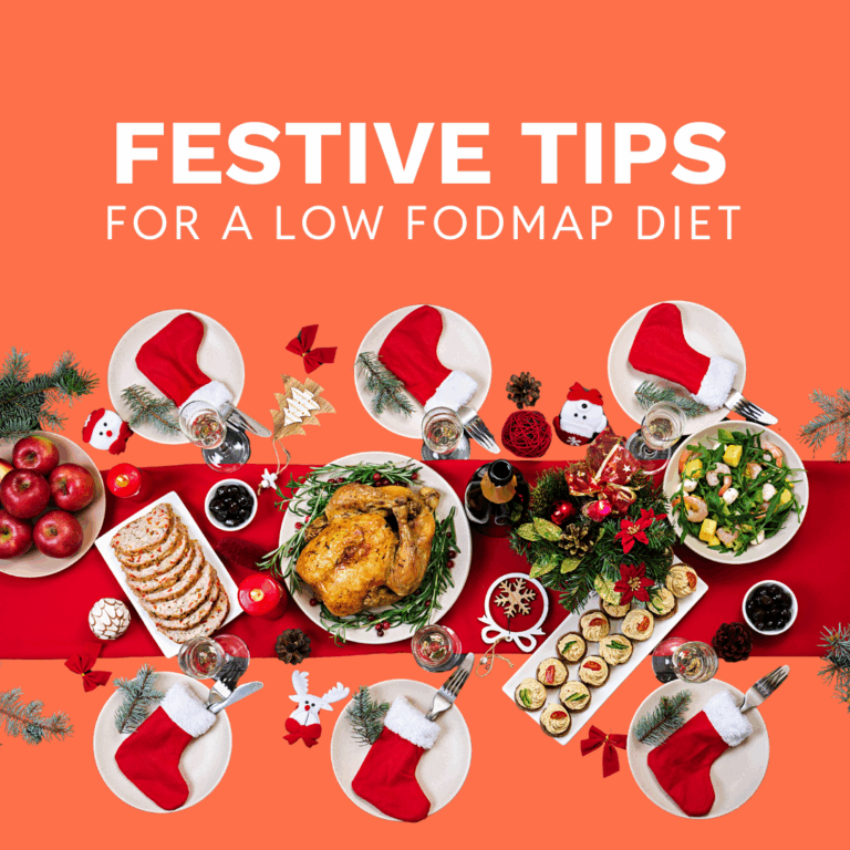 A festive table setting with roast chicken, salad, bread, vegetables, and Christmas decorations. Text above reads Festive Tips For a Low FODMAP Diet on an orange background—perfect seasonal advice for the festive season.