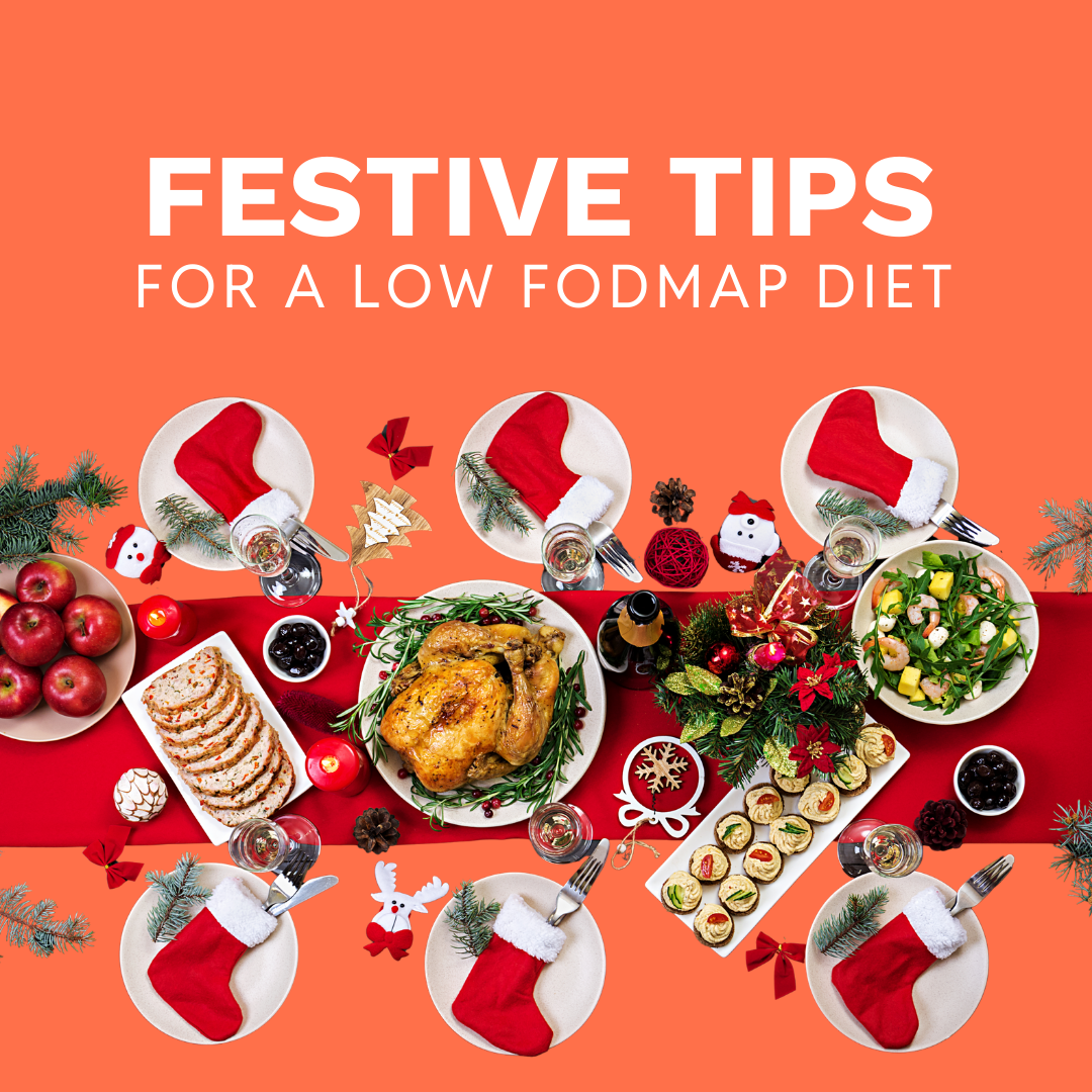 A festive table setting with roast chicken, salad, bread, vegetables, and Christmas decorations. Text above reads Festive Tips For a Low FODMAP Diet on an orange background—perfect seasonal advice for the festive season.
