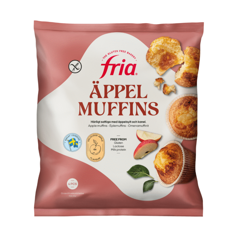 A pink bag of Fria Apple Muffins. The packaging features images of muffins, a sliced apple, and cinnamon. Text highlights the product as gluten-free, lactose-free, and that each pack contains four delicious gluten-free apple muffins.