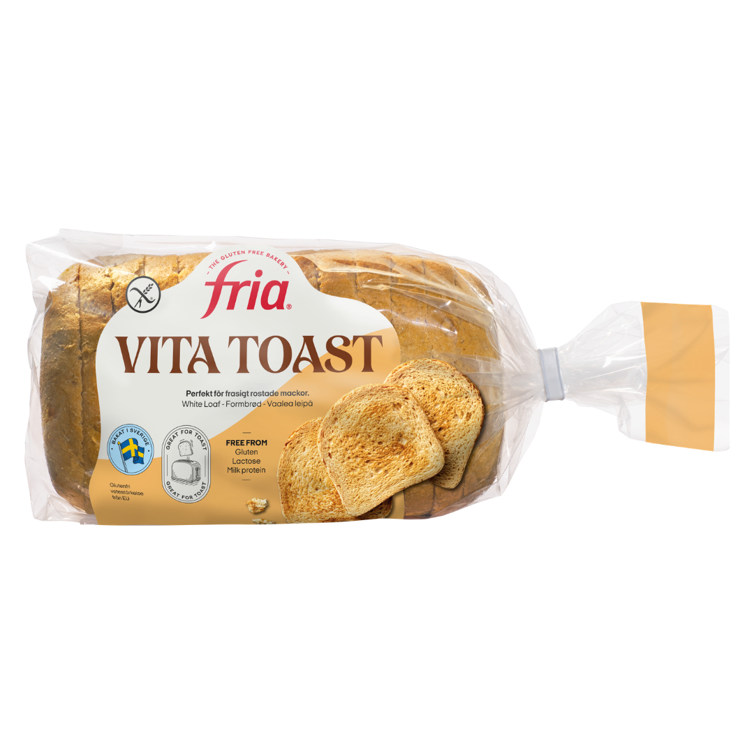 A clear plastic bag of Fria Vita White Toast, showing sliced gluten-free white bread inside. The label features the Fria Vita brand name, images of toasted bread slices, and highlights that the product is gluten-free.