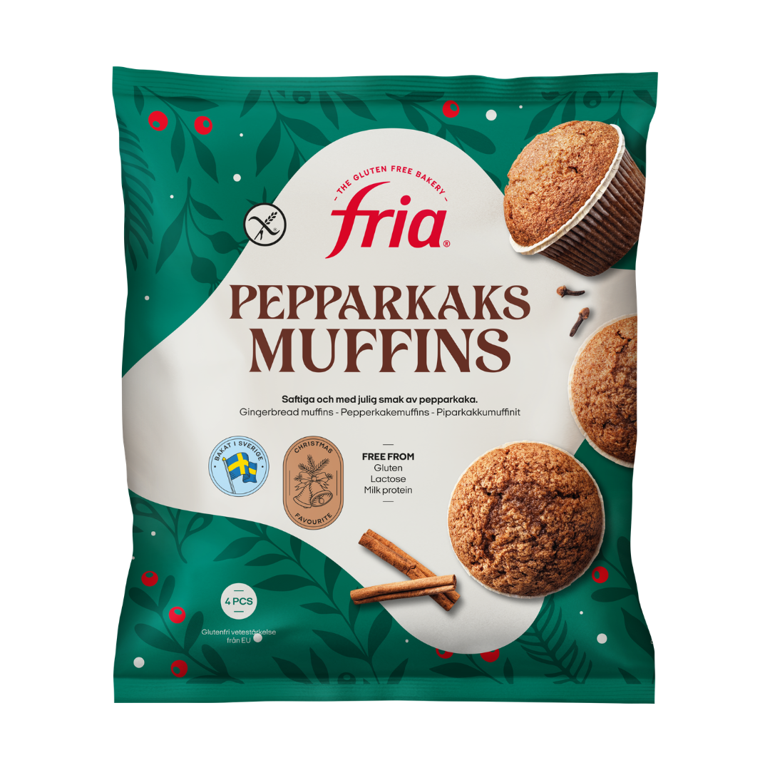A green bag of Fria gluten-free pepparkaksmuffins with images of muffins and holiday spices. The packaging highlights that the gingerbread muffins are free from gluten, lactose, and milk protein. There are four muffins in the pack.