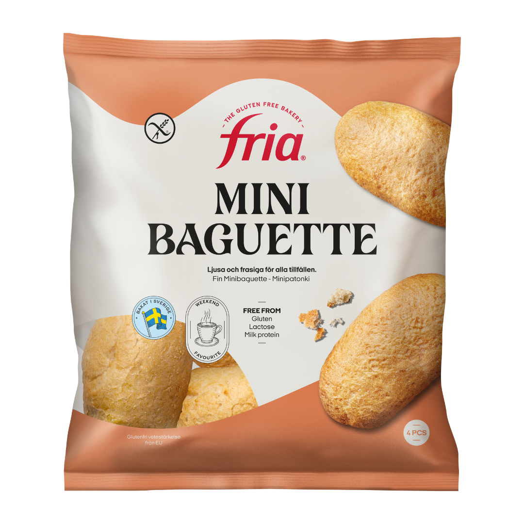 A pack of Fria Multiseed Baguettes, showing four golden-brown baguettes on a white and orange background. The pack is labelled gluten-free, lactose-free, and milk protein-free.