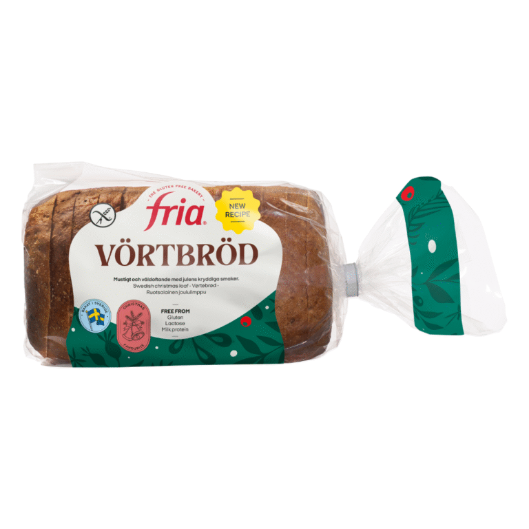 A loaf of Fria Gluten-Free Vörtbröd bread in clear packaging with green and white labels, showing sliced dark bread. The packaging highlights it as a new recipe and gluten-free.