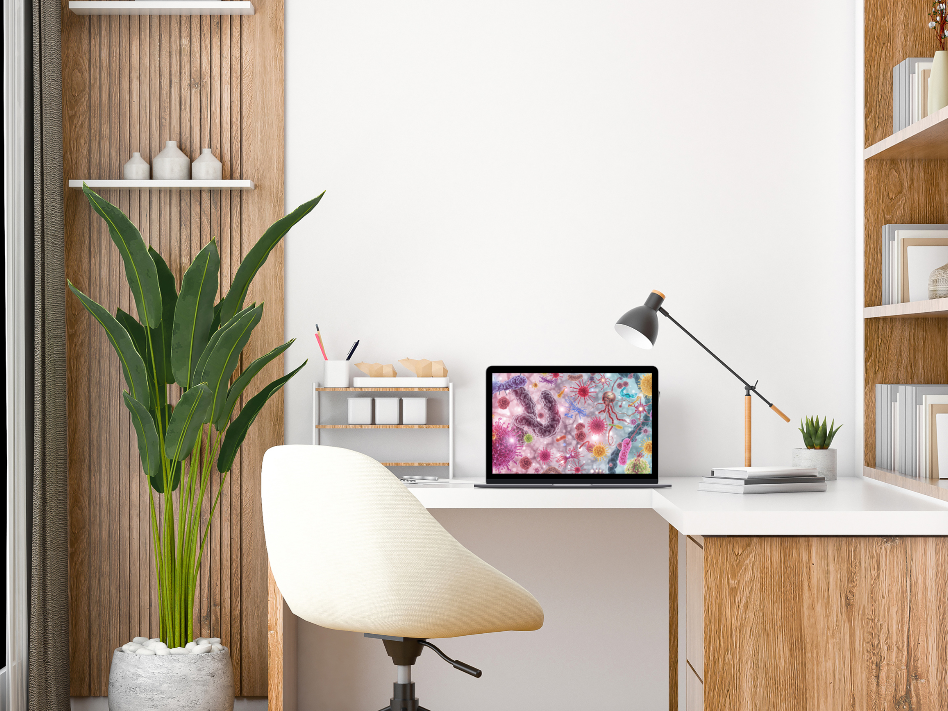A modern home office with a wooden desk, white chair, potted plant, desk lamp, and a laptop displaying a colourful science-themed wallpaper about causes and symptoms, set against a white wall with shelving and decorative items.