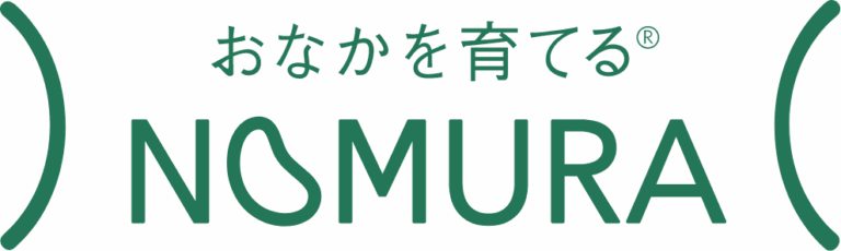 Green text logo with Japanese characters above the word NOMURA in all caps, stylised with curved lines on the left and right, and a registered trade mark symbol next to the Japanese text.
