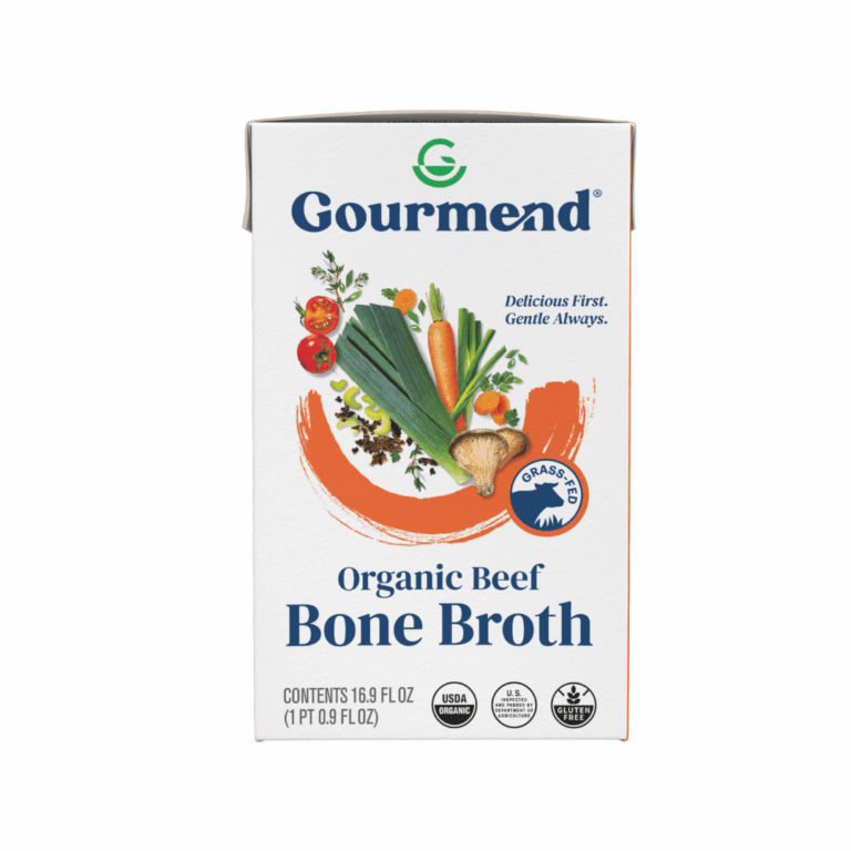 Front view of a Gourmend Organic Beef Bone Broth carton featuring images of vegetables, a grass-fed seal, and organic certification logos. The text highlights this Beef Bone Broth as organic and always delicious.
