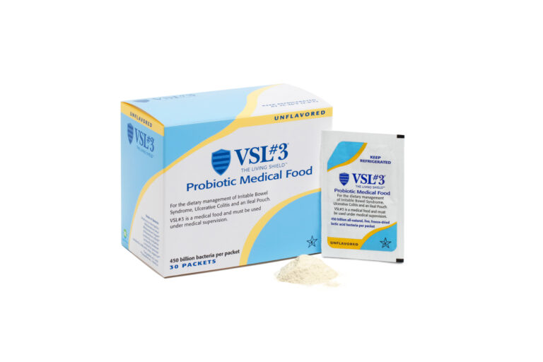 A box of VSL#3 Probiotic Medical Food with one 450B Unflavoured Powder sachet and some powder beside it. The blue, yellow, and white packaging is labelled for dietary management of IBS and other conditions.