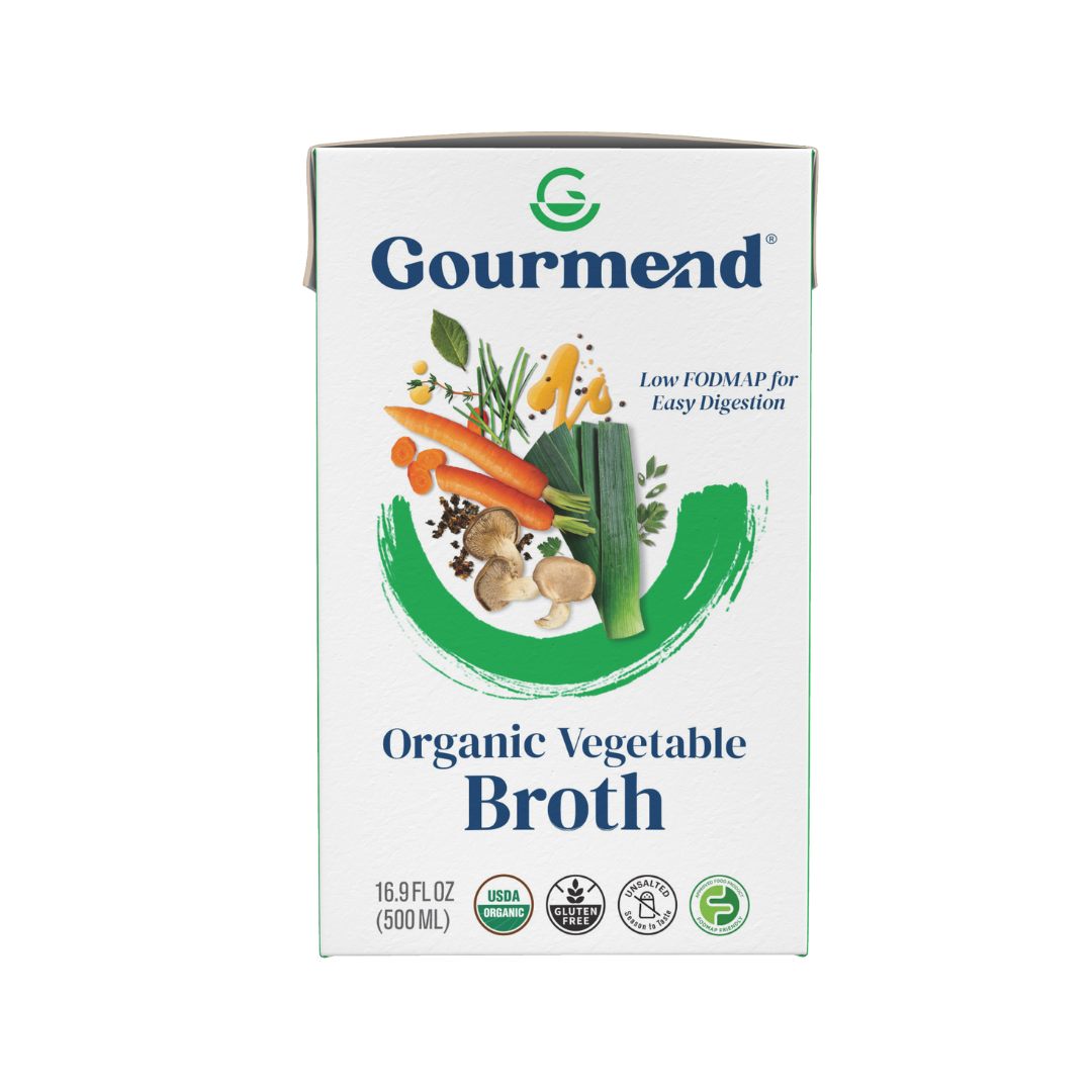 A carton of Gourmend Organic Vegetable Broth featuring illustrations of carrots, celery, and mushrooms. The packaging highlights it as low FODMAP, USDA organic, easy to digest—perfect alongside Gourmend Organic Beef Bone Broth options.