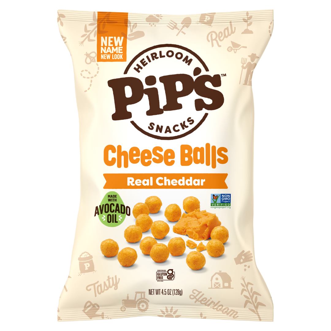 A bag of Pips Heirloom Snacks Cheese Balls, Real Cheddar flavour. The packaging features cheese balls, a cheddar wedge, and labels for avocado oil and non-GM ingredients—perfect for fans of mini popcorn and other Heirloom Snacks. Net weight: 4.5 oz (128g).