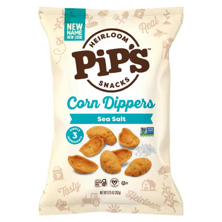 A bag of Pips Snacks Heirloom Corn Dippers in Sea Salt flavour. The beige bag, from the makers of Heirloom Snacks, features corn dippers and a small pile of salt, highlighting 3 simple ingredients and Non-GMO Project Verified labels.
