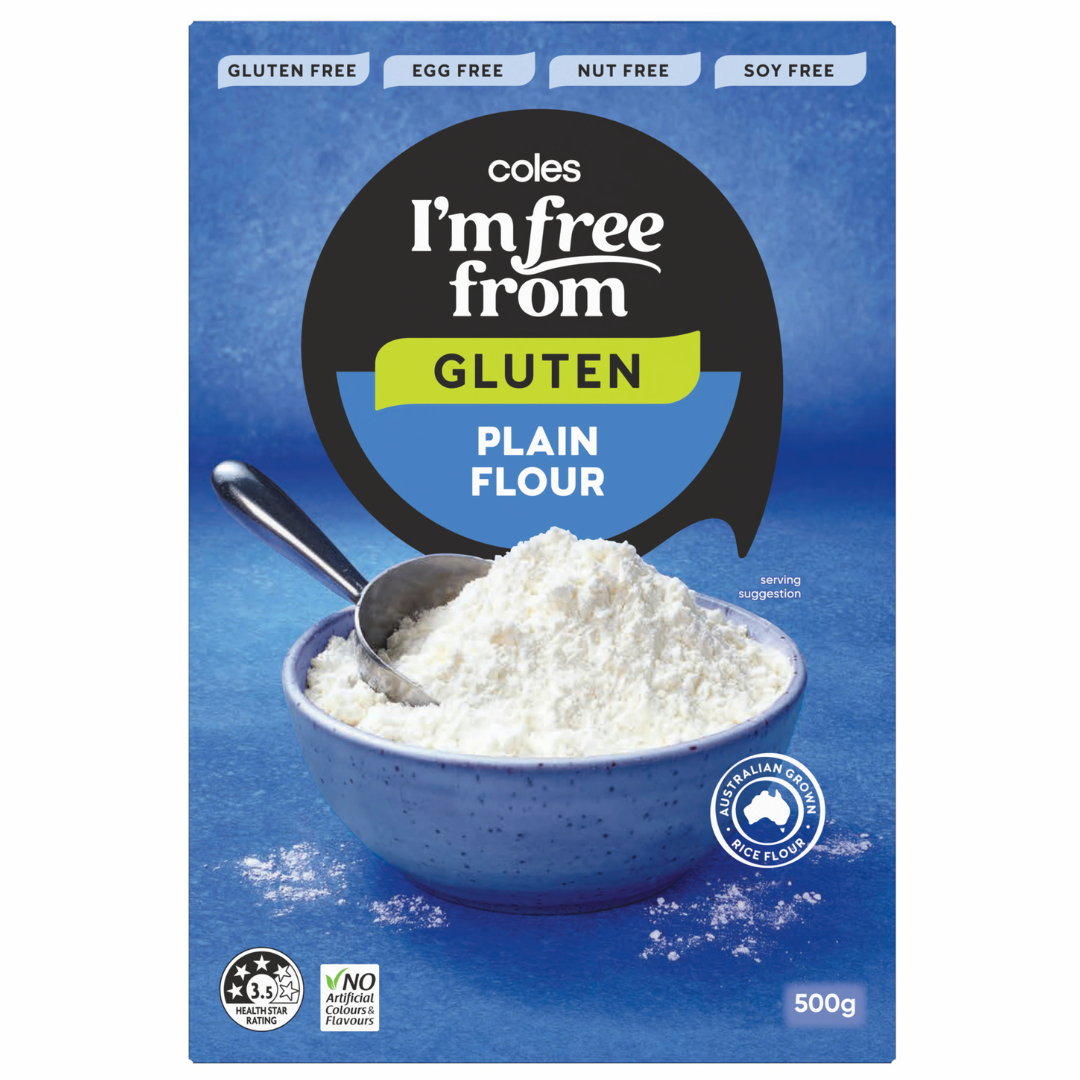 A blue box of Coles I'm Free From gluten-free plain flour, featuring a bowl filled with flour and a metal spoon, alongside labels highlighting it's gluten, egg, nut, and soya free—perfect for baking or making homemade Salt & Vinegar Crisps. 500g pack.