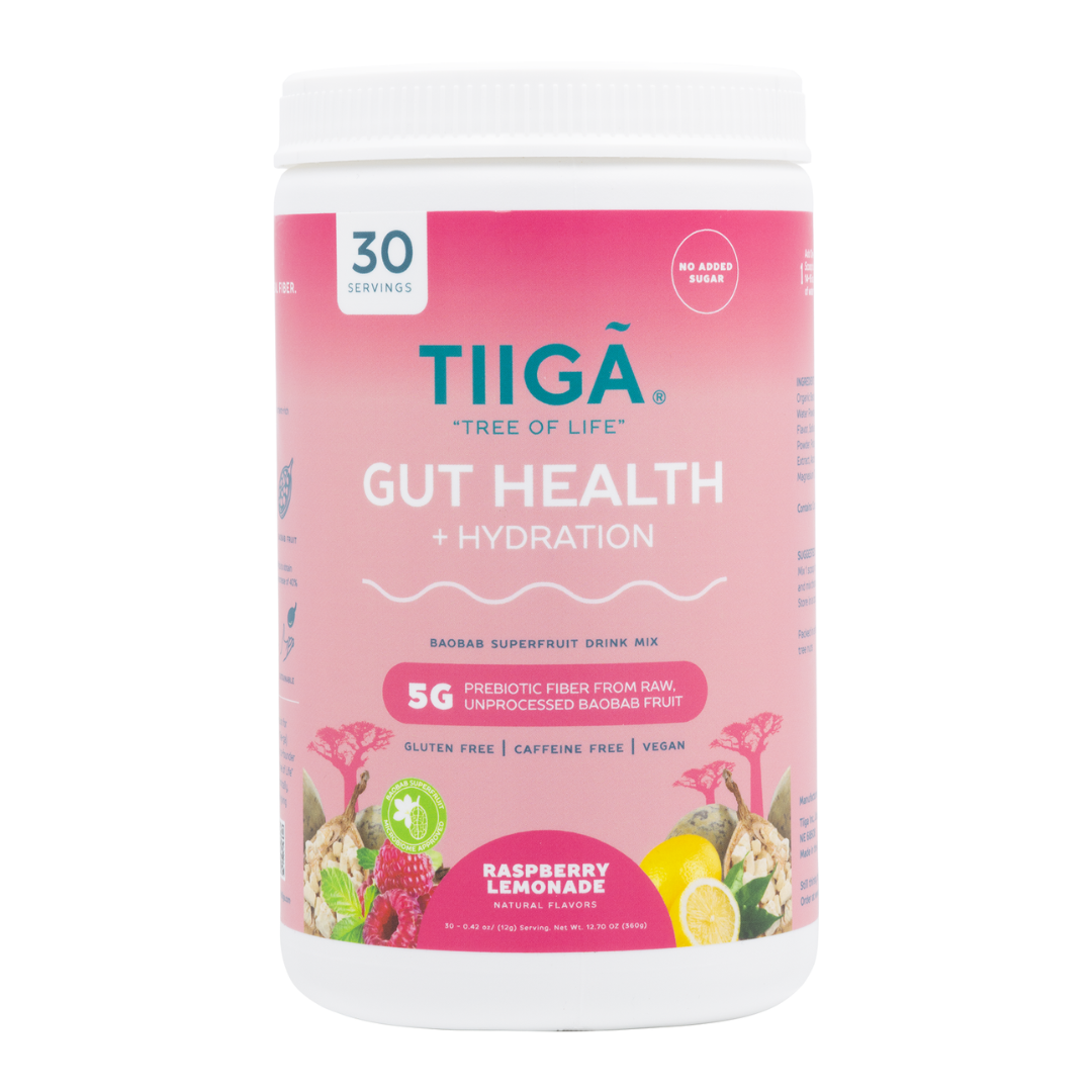 A container of TIIGA Gut Health + Hydration baobab superfruit drink mix in refreshing Raspberry Lemonade flavour, featuring 30 servings, no added sugar, gluten free, caffeine free, and vegan. The label displays vibrant fruits and flowers.