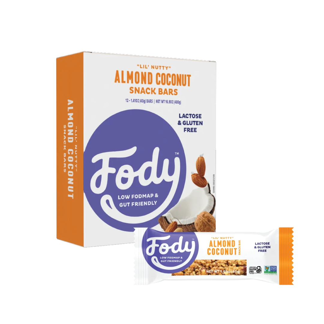 A box and a single Fody Almond Coconut Snack Bar. The packaging highlights these snack bars are lactose and gluten free, low FODMAP, and gut friendly. The orange and white box features images of almonds and coconut.