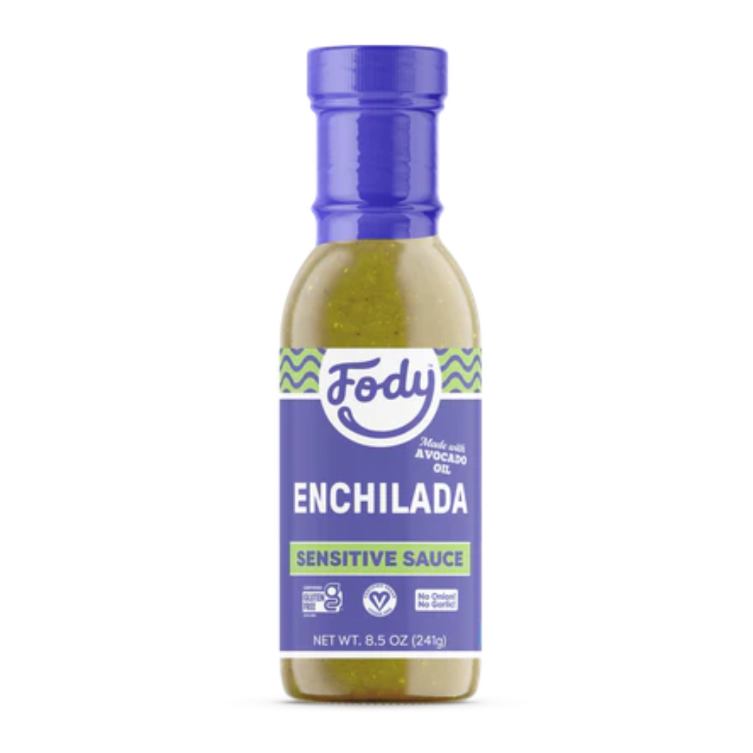 A bottle of Fody Green Enchilada Sauce Sensitive, made with avocado oil. The blue-capped bottle features a blue label with green accents, highlighting vegan, gluten-free, and no onion or garlic icons. Net weight is 8.5 oz (241g).