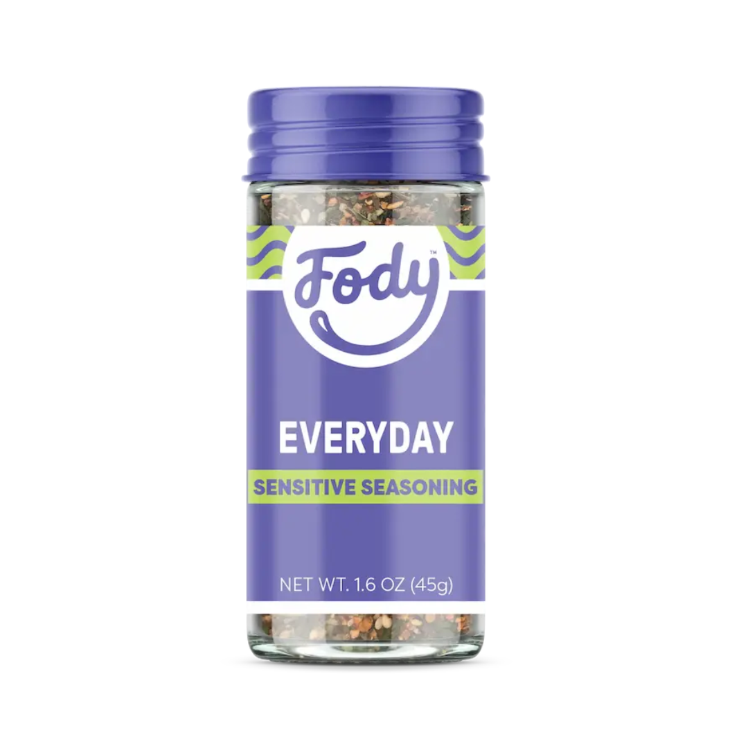 A clear plastic spice jar with a purple lid and label, displaying the Fody brand. The label reads EVERYDAY SENSITIVE SEASONING and notes a net weight of 1.6 oz (45g)—perfect for adding flavour to dishes like Green Enchilada Sauce.