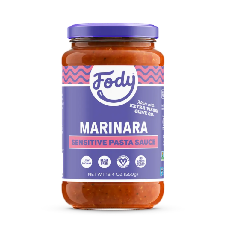 A jar of Fody Marinara Pasta Sauce with a purple label, highlighting “low FODMAP,” “bloat free,” “no added sugar,” and “made with extra virgin olive oil.” Net weight is 19.4 oz (550g).
