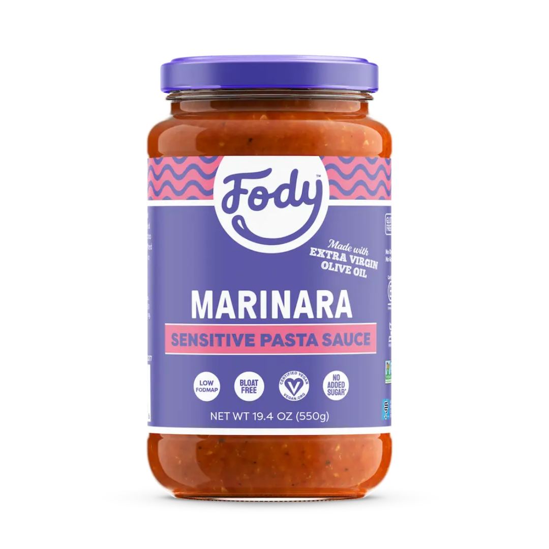 A jar of Fody Marinara Pasta Sauce with a purple label, highlighting “low FODMAP,” “bloat free,” “no added sugar,” and “made with extra virgin olive oil.” Net weight is 19.4 oz (550g).